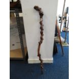 Knobbly vine root walking stick with silver cartouche