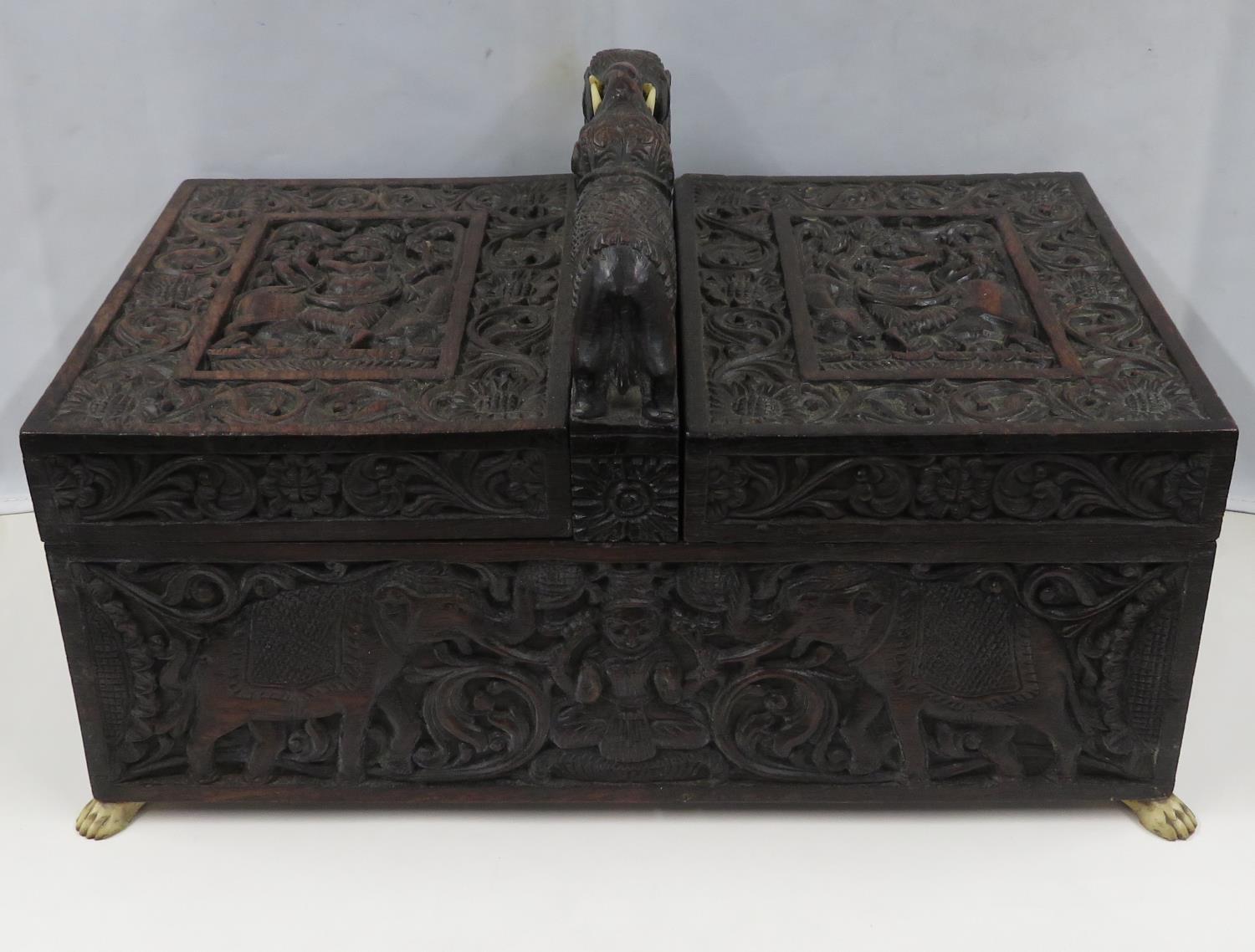 Highly carved Indian ebony box with elephants and carved ivory lion paw feet 12" x 6" x 7"