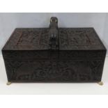 Highly carved Indian ebony box with elephants and carved ivory lion paw feet 12" x 6" x 7"