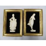 2x 4" ivory silhouette carvings framed on velvet