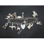 Vintage silver charm bracelet with 12x charms Birmingham 1977 36g