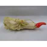 Carved and coloured ivory celery shoot with red chilli and grasshopper climbing up it 7" long