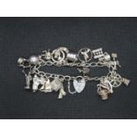 Vintage silver charm bracelet 20x charms fully HM London 1979 44.2g