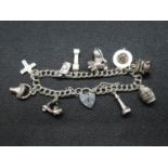 Silver charm bracelet with 10x charms London 1986 26.5g
