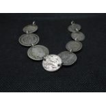 8x 19thC silver coins previously in bracelet