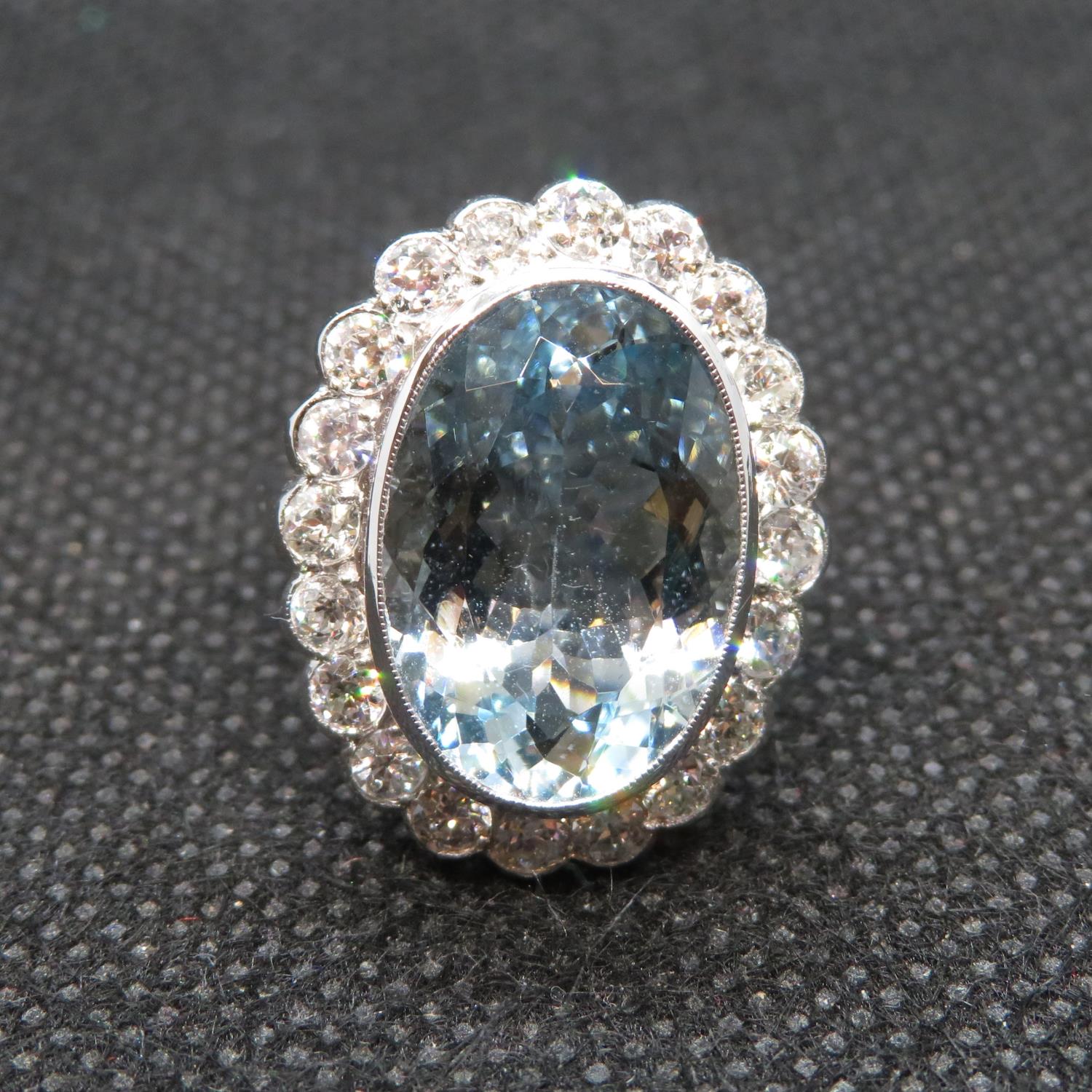 18ct ladies gold and platinum aquamarine diamond ring. Oval aquamarine est. weight 8cts.