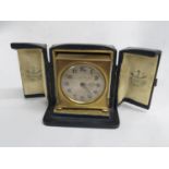 Leather boxed travel clock by Zenith retailed by Butts and Co Chester fully working small crack to