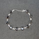 Silver tennis bracelet set with dark Australian sapphires 11.4g 8"