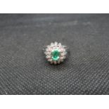 18ct white gold emerald and diamond cluster ring Emerald est. .5ct finger size P stamped 750