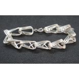 Modernist silver hand made bracelet each link continuous length of square silver wire 35.5g