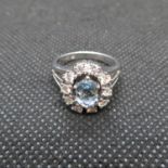 White gold and aquamarine cluster ring 15ct .5ct diamond and 1ct aquamarine