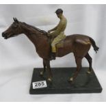 Cold painted bronze signed Bergman No3927 of a jockey on horse 10" long 8" high on marble plinth