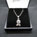 Silver pendant Charles Mackintosh style set with blue topaz stone on 18" silver chain with box
