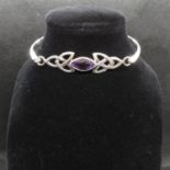 Silver Celtic style bangle by Kit Heath designs stamped KH 96 set with marquis amethyst stone 9.7g