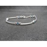 HM silver bracelet set with 5x French cut blue topaz stones 7.5" 8.3g