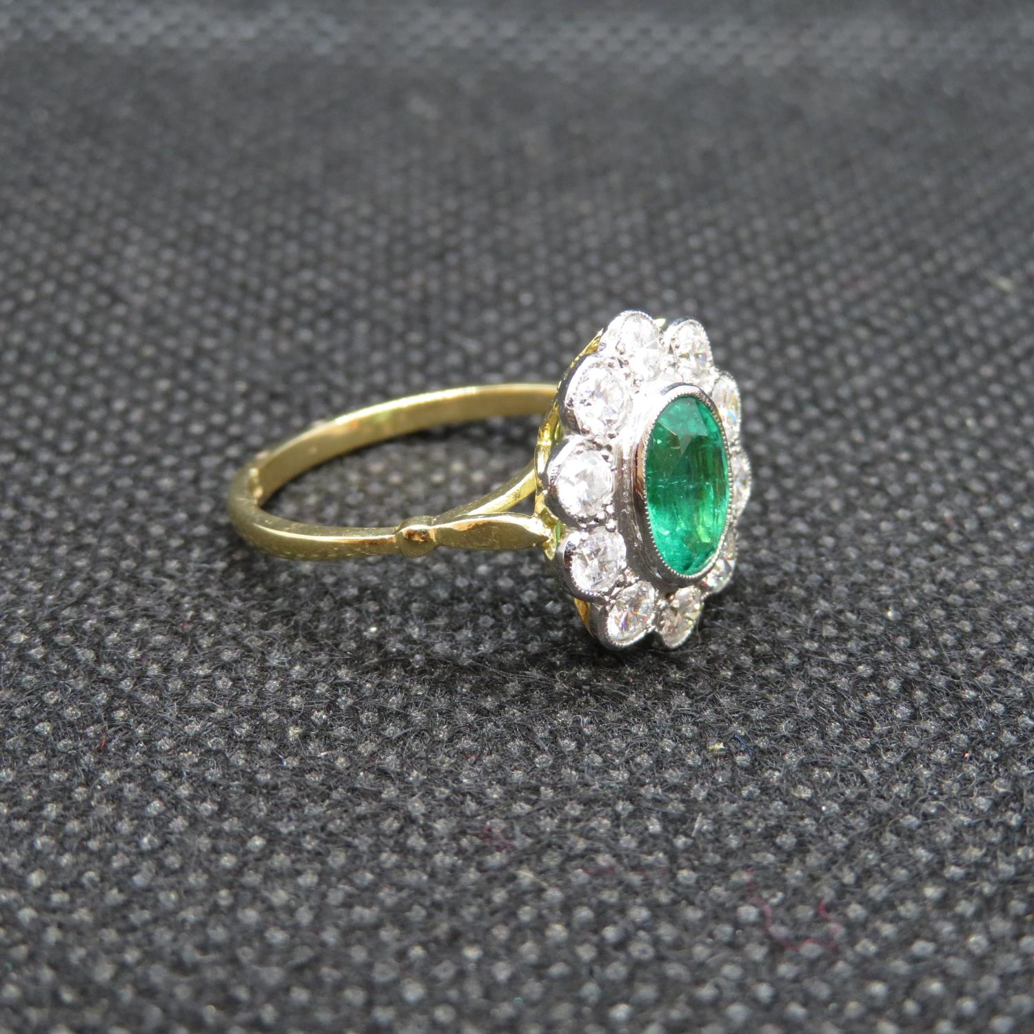 18ct gold and platinum cluster ring with central oval emerald approx 1.2ct with 10 natural brilliant - Image 2 of 3