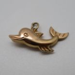 9ct dolphin charm approx 1.5g
