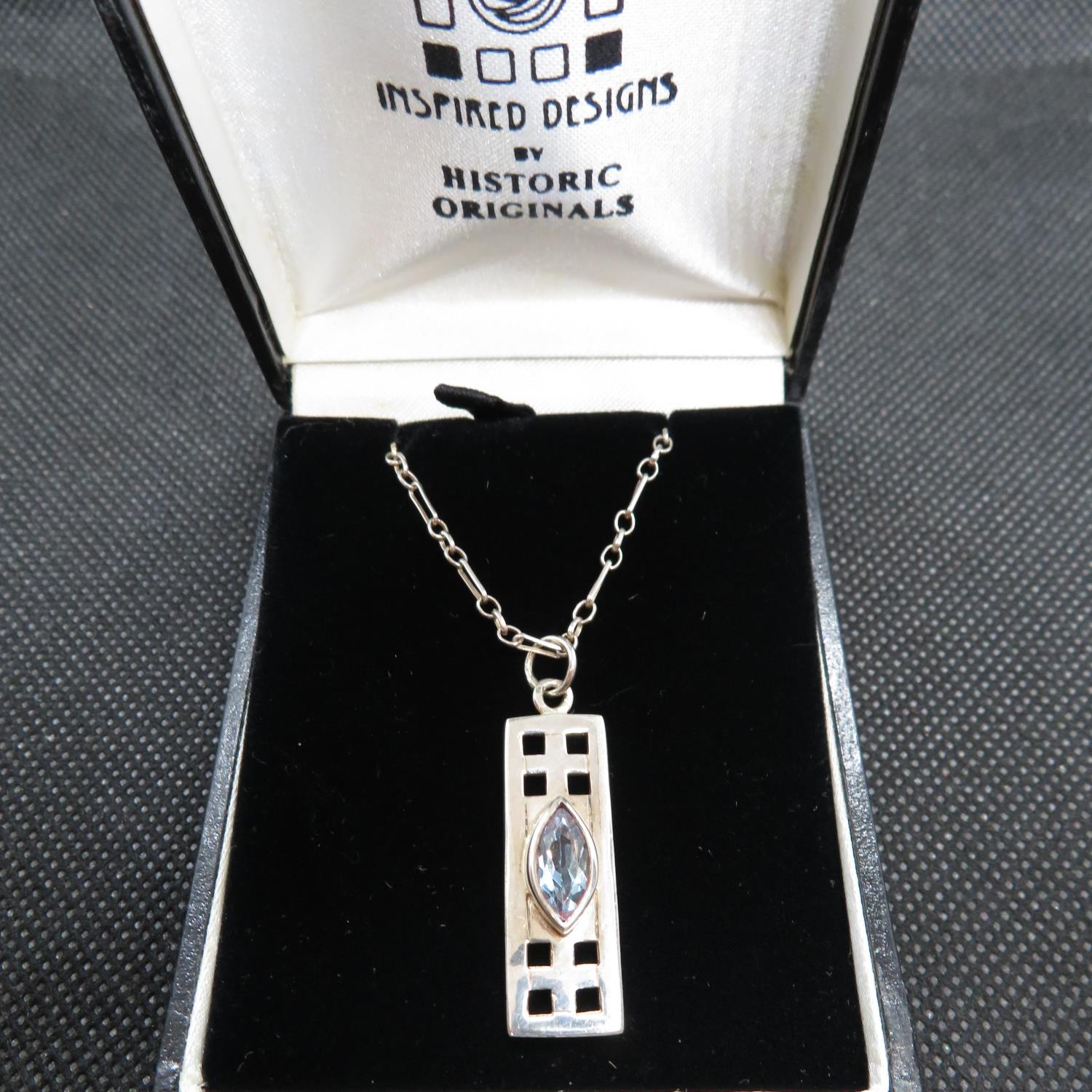 Charles Rennie style pendant set with Marquis cut blue topaz on 18" chain in box 6.5g