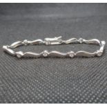 HM silver wave bracelet set with white stones 7" long 8.3g