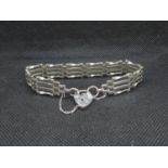 Silver 4 bar bracelet with lock and chain HM London 1978 14.9g