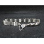 Vintage silver 4 bar gate bracelet with lock and safety chain London 1981 7g