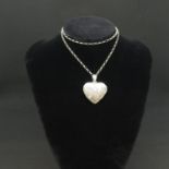 Silver heart shaped locket on 20" silver chain 13.4g
