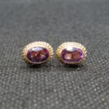 9ct gold earrings set with oval amethyst stones