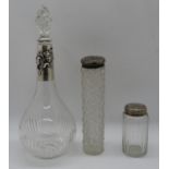 3x glass bottles with silver lids