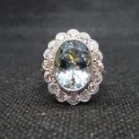 Stunning 18ct gold cluster ring centre oval aquamarine approx 5cts with 16 brilliant cut diamonds