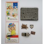 Collection of whistles, badges, purse and Lucy Atwell postcards