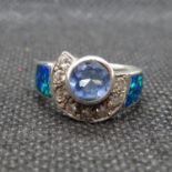 Silver abstract ring set with blue topaz cubic Zirconia and black opal 5g