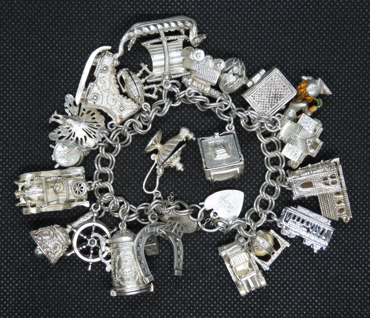 George Jensen vintage silver bracelet with 21 unusual and rare charms GJ Ltd. HM London 1972 116.4g