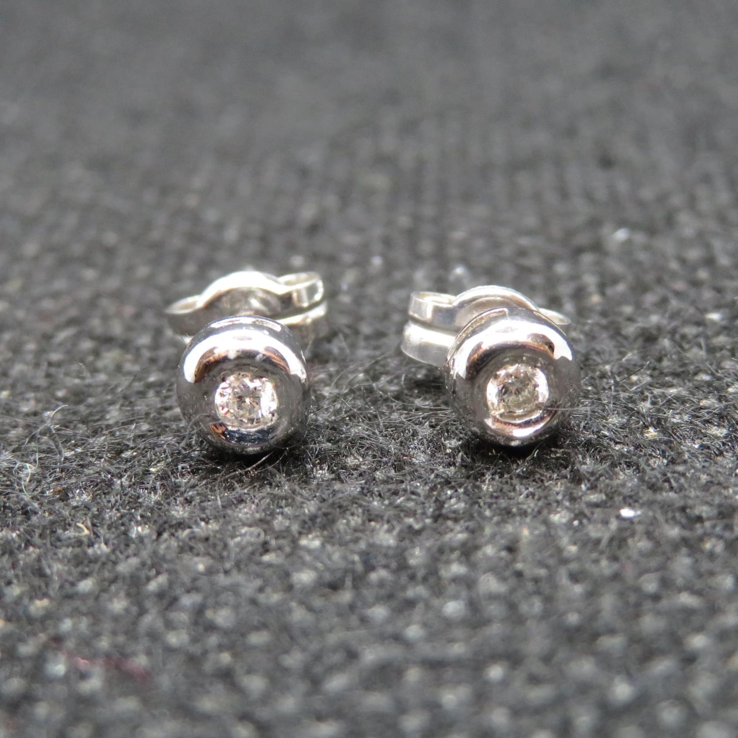 Nice pair of 9ct white gold and diamond earrings
