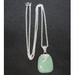 Jade and silver pendant on 20" silver chain 15.5g