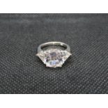Silver bling ring with cushion cut centre stone and brilliant cut sides size K
