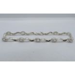 Silver bracelet set with oval CZ stones 7.5" 7.1g