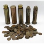 Collection of detonators and shell casings and trench art lighter and coins