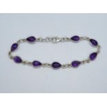 Silver bracelet set with pear shaped cabochon amethyst 7.75" 7g