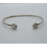 Silver bangle with heart terminals set with CZ stone