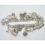 Silver charm bracelet HM London 1978 20 charms 62.5g