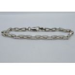 HM SILVER CROSSOVER BRACELET 8" LONG 12.9G