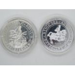 2x silver coins in capsules