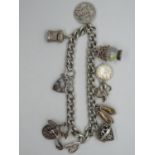 Silver charm bracelet 9x charms 52g