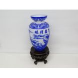 Blue and white glass vase on stand 12"