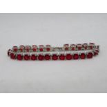 Red stone and silver tennis bracelet