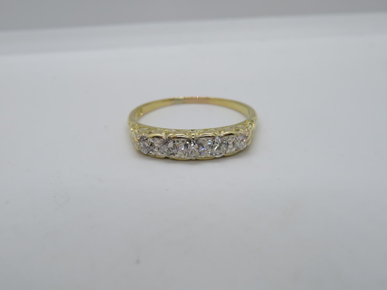 Victorian 18ct gold ring with carved shank set with 5x old cut diamonds approx .5ct size R 2.8g