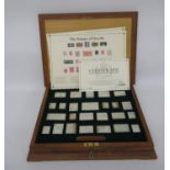 Wooden box with set of stamps of Royalty in silver