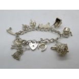 Vintage silver charm bracelet with 10 nice charms London 1978 35.9g