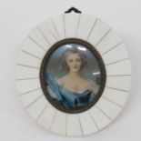 Miniature picture of lady in bone frame indistinctly signed