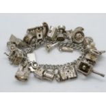 Large 124g articulated charm bracelet with 25x rare charms